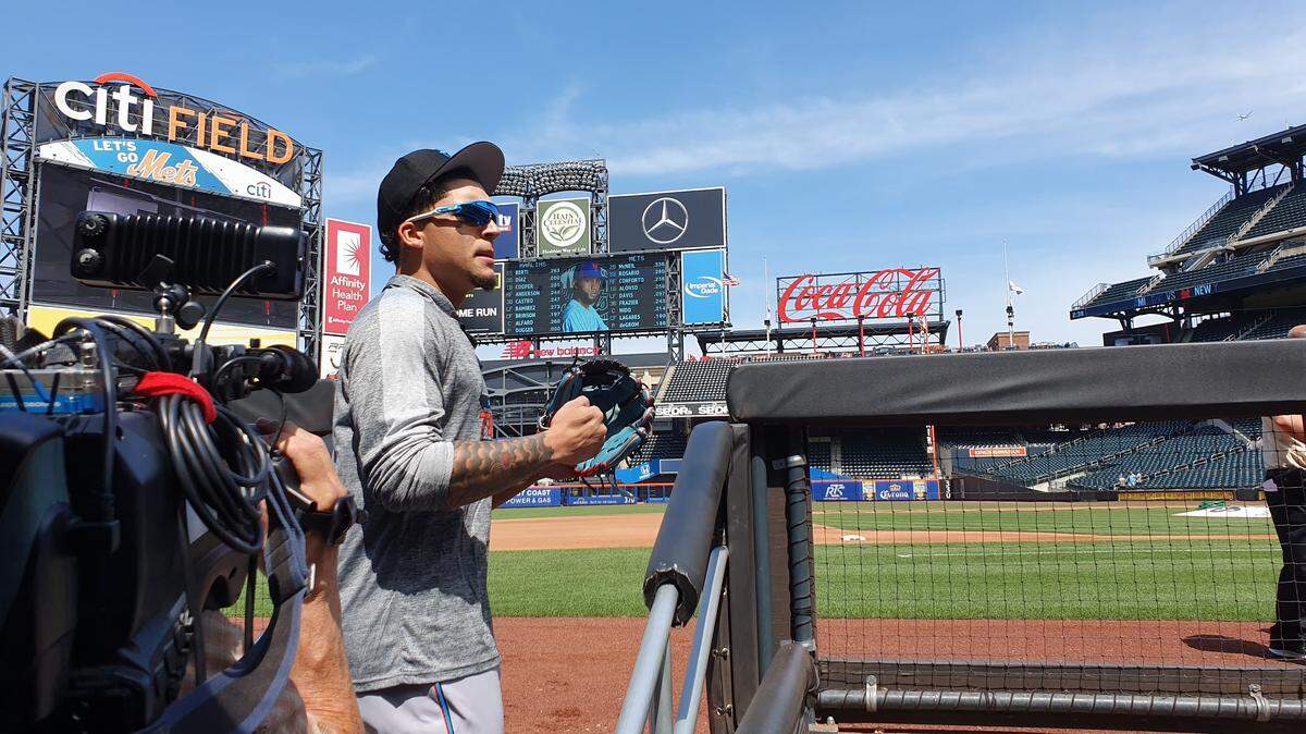 Miami Marlins second baseman Isan Diaz head to the field for pregame warmups before his MLB debut against the New York Mets on Monday, Aug. 5, 2015, at Citi Field in New York
