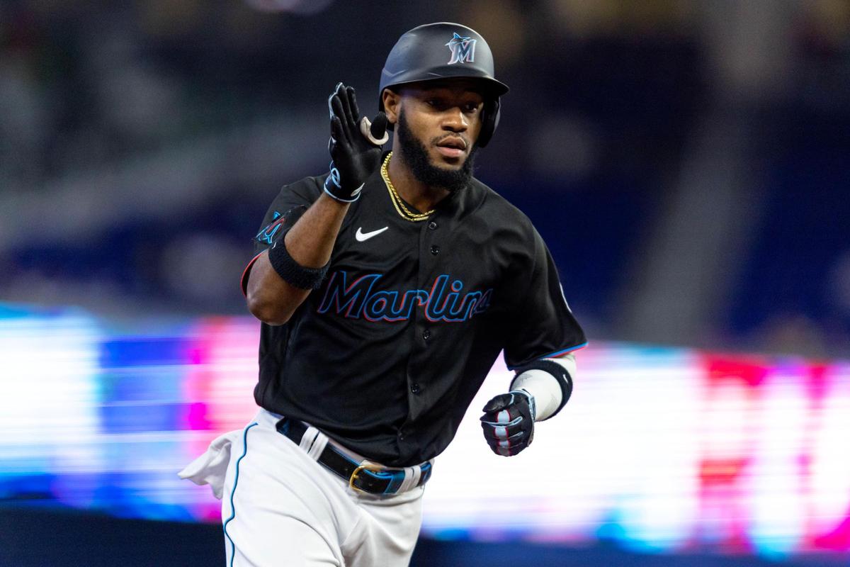 Miami Marlins base runner Bryan De La Cruz (14) reacts toward his team’s dugout after hitting a homerun during the second inning of Thursday’s game against the Washington Nationals at loanDepot park in Miami.
