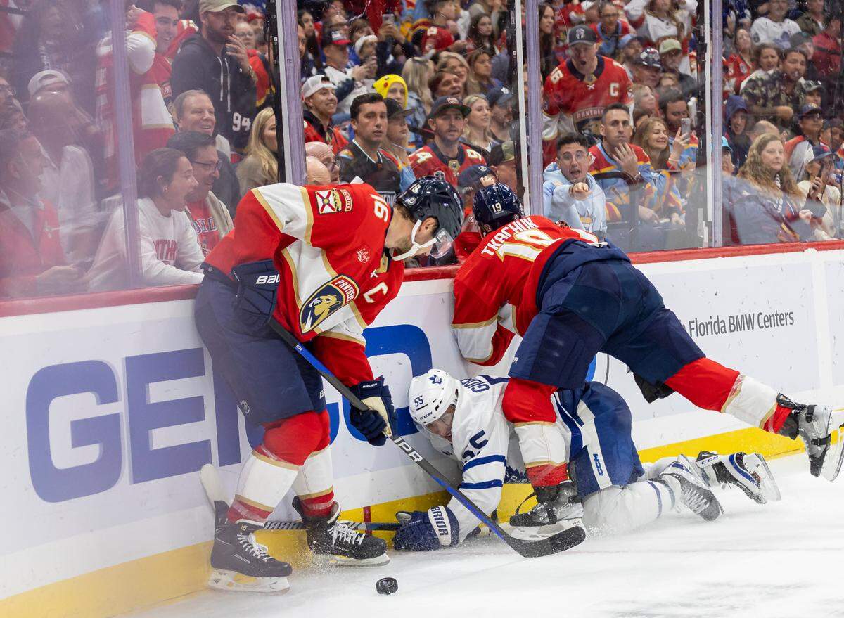 Florida Panthers center Aleksander Barkov (16) and left wing Matthew Tkachuk (19) recover the puck from Toronto Maple Leafs defenseman Mark Giordano (55) in the second period of their NHL game at the Amerant Bank Arena on Thursday, Oct. 19, 2023, in Sunrise, Fla.