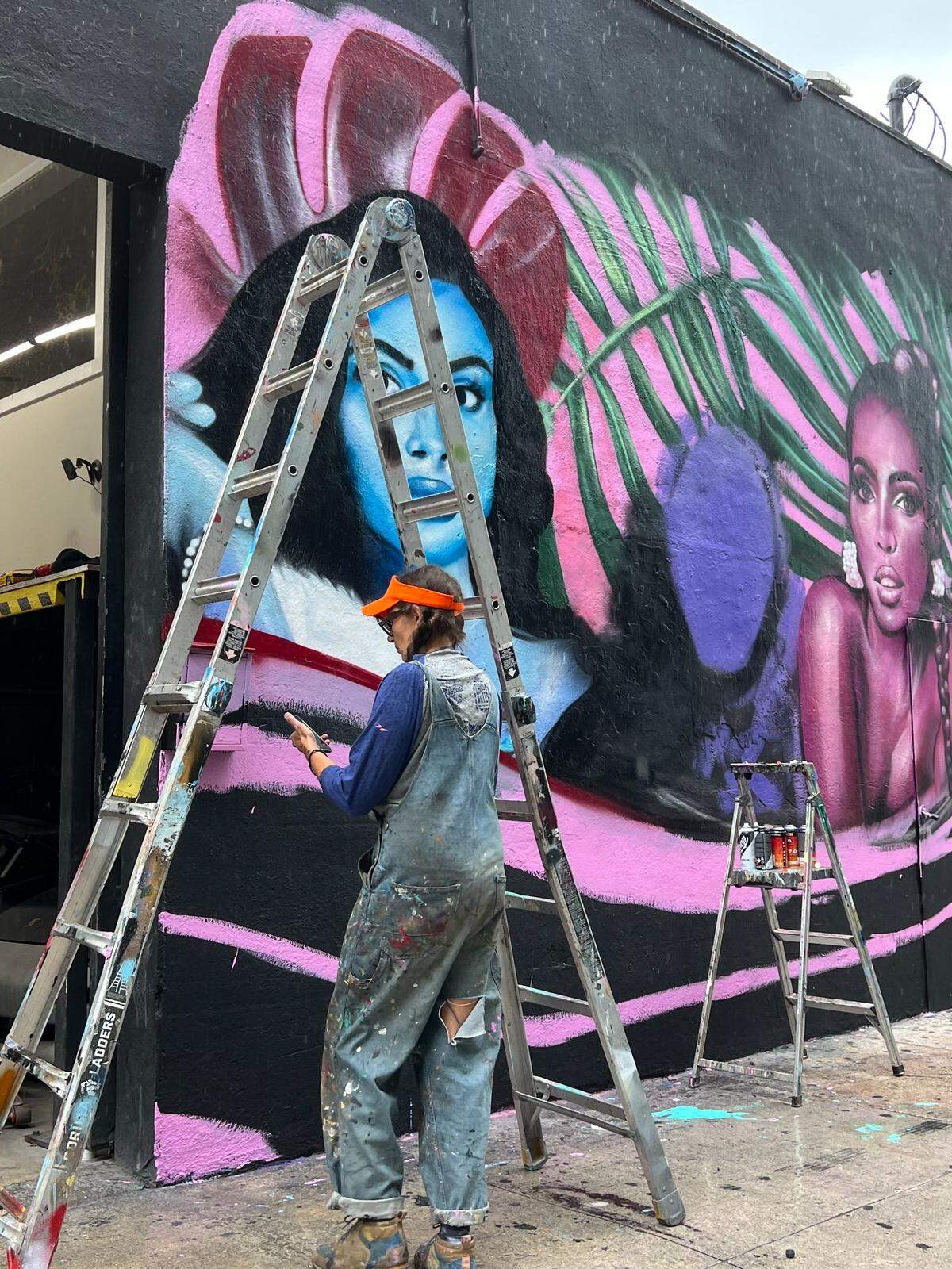 California-based graffiti and mural artist Jules Muck works on the OnlyFans mural celebrating creators.