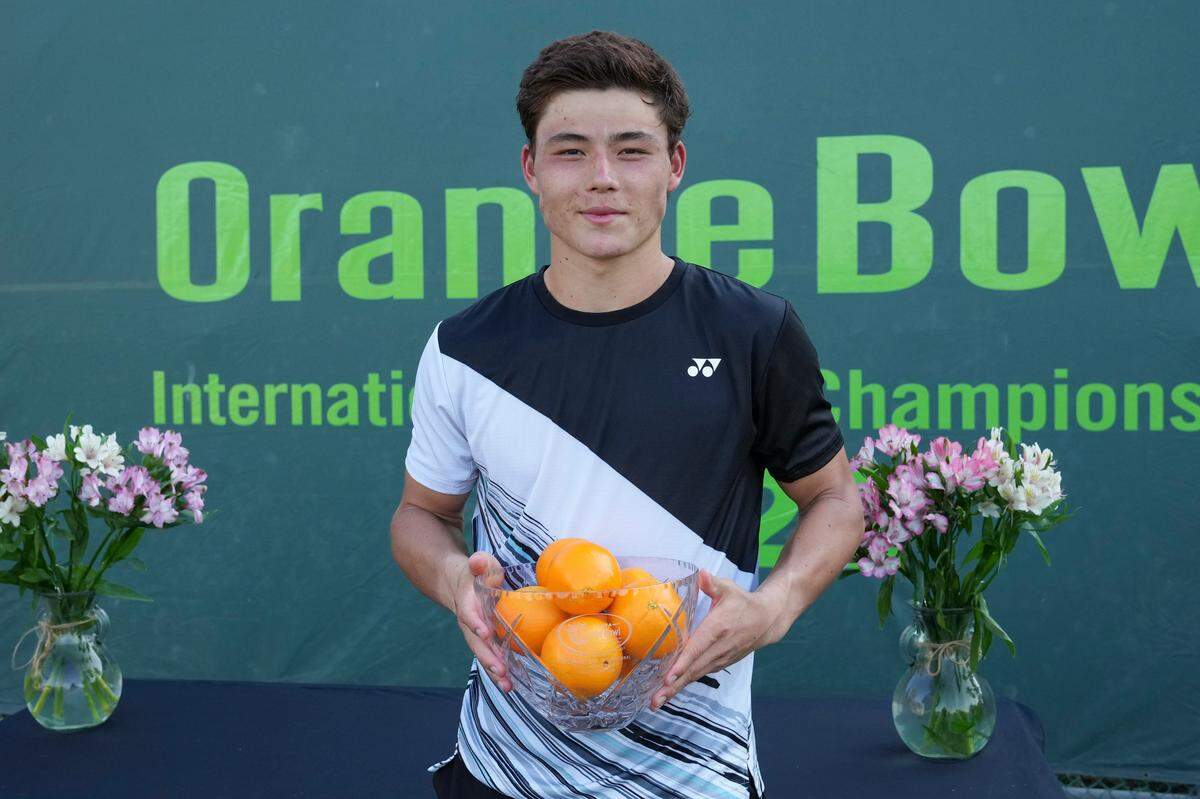 December 11, 2022 – Gerard Campana Lee, the 18 and Under Champion poses with the trophy at the Orange Bowl International Tennis Championships at the Veltri Tennis Center in Plantation, Florida.