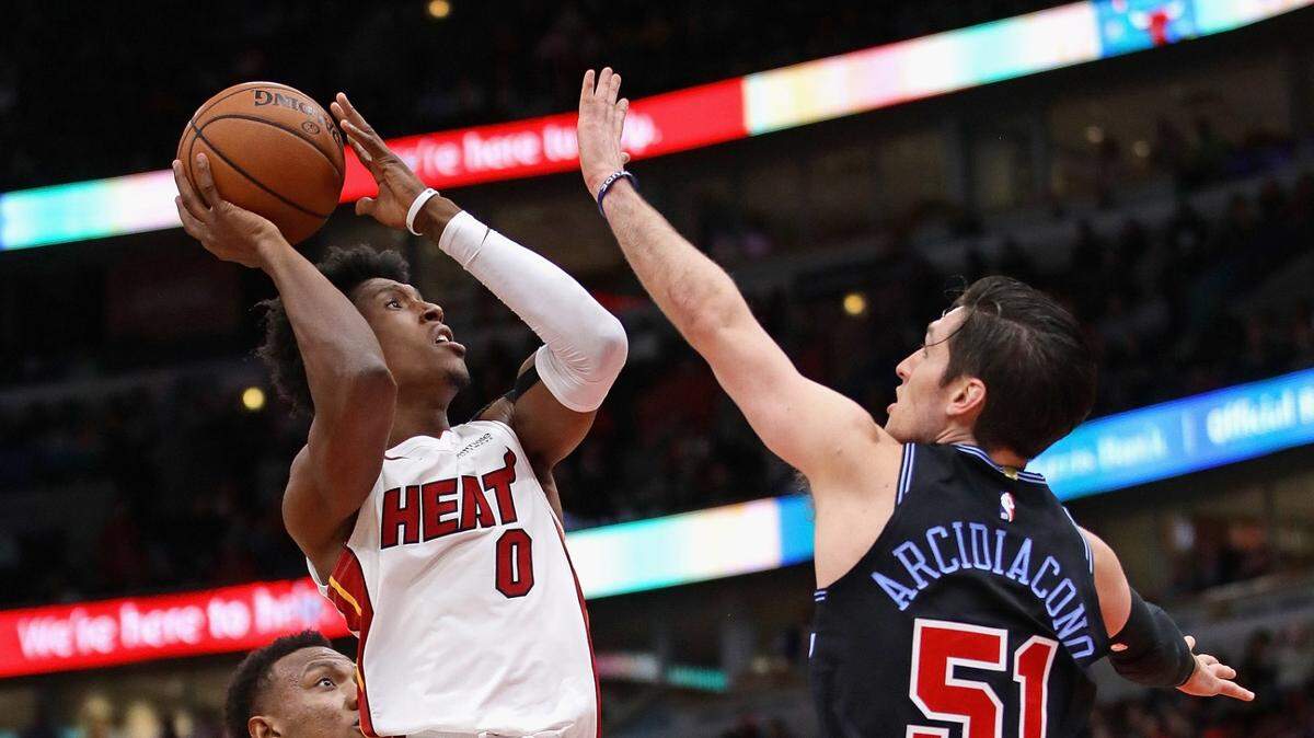 Miami Heat’s Josh Richardson (0) puts up a shot against Chicago Bulls’ Ryan Arcidiacono (51) at the United Center on Nov. 23, 2018 in Chicago.