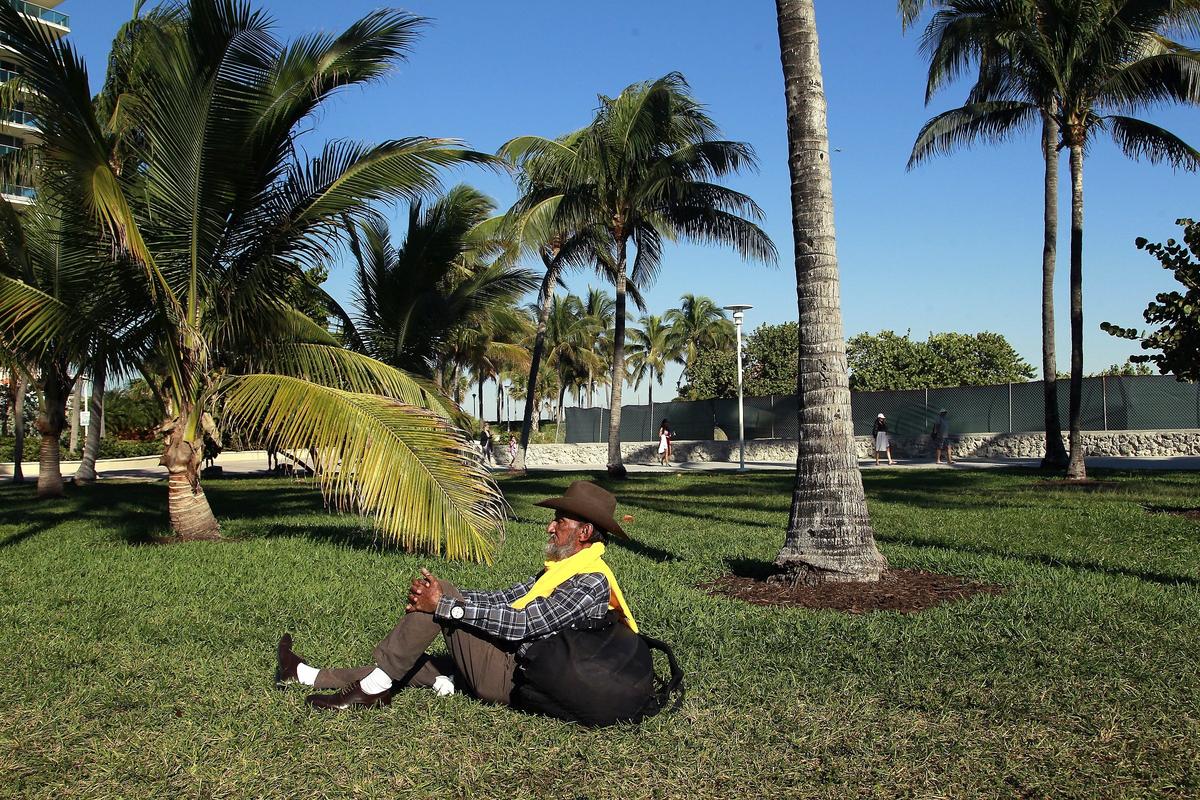 Jose Montesino takes in the sun in Lummus Park on Thursday, Jan.10, 2019, on South Beach, where a new municipal prosecutor program targeting low-level offenses has mostly affected the homeless.