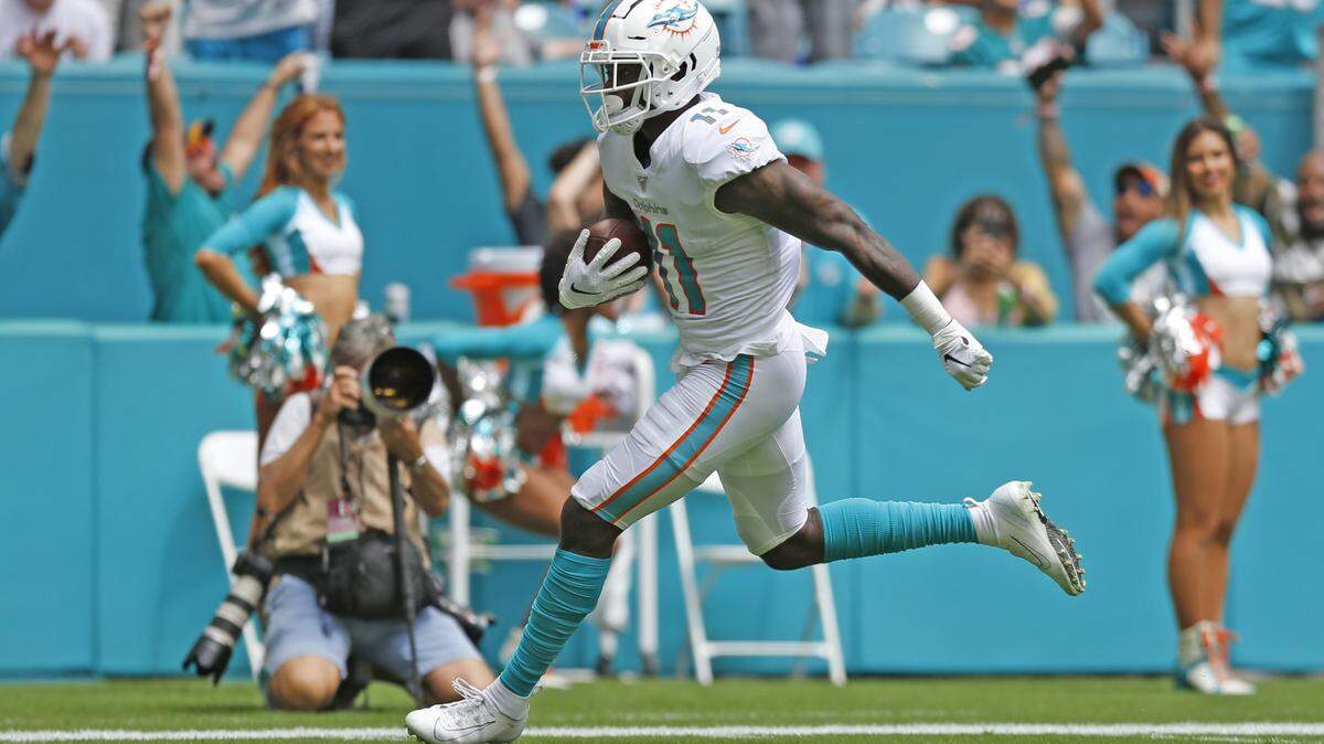 Miami Dolphins wide receiver DeVante Parker (11) runs in for a touchdown in the first quarter as the Miami Dolphins host the Los Angeles Chargers on Sunday, September 29, 2019.