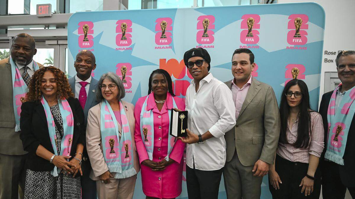 Retired Brazilian soccer star Ronaldinho, a two-time FIFA World Player of the Year, poses with South Florida politicians and dignitaries and received a key to Miami-Dade County after being named an ambassador for the 2026 World Cup Miami Host Committee.