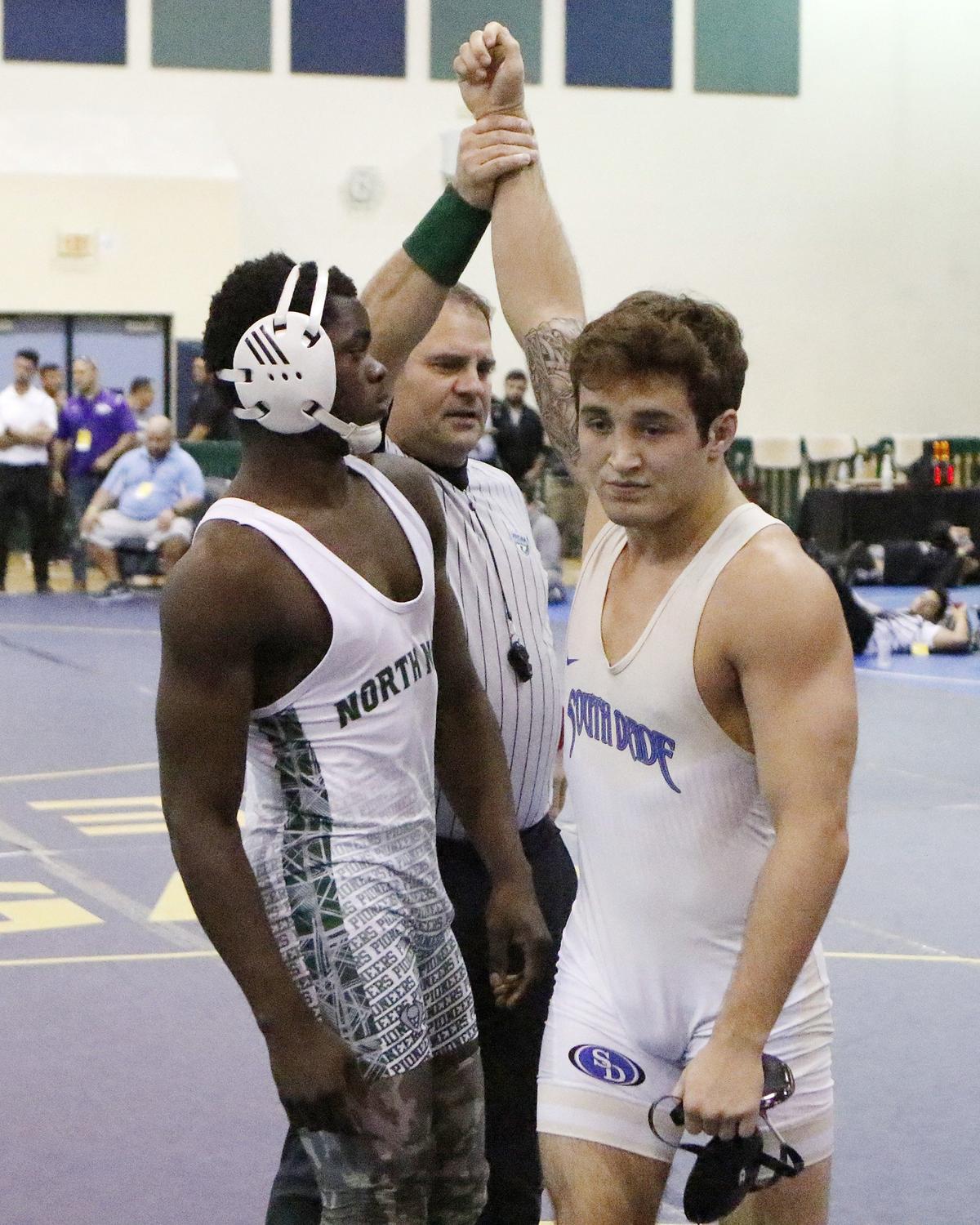 Brevin Balmeceda of South Dade, 160 lbs class, wins a match against North Miami’s Rivaldo Valmy during the Region 4-3A HS wrestling finals on March 2, 2019 at Ronald W. Reagan Doral Senior HS in Doral