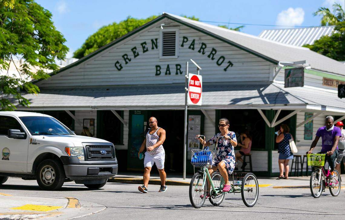 People make their way past Green Parrot Bar in Key West, Florida, on Tuesday, Oct. 12, 2021.