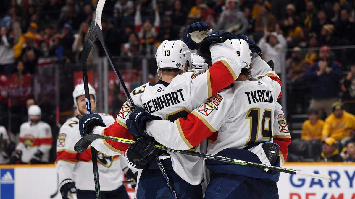 Jan 22, 2024; Nashville, Tennessee, USA; Florida Panthers center Sam Reinhart (13) is congratulated by teammates after a goal during the second period against the Nashville Predators at Bridgestone Arena.