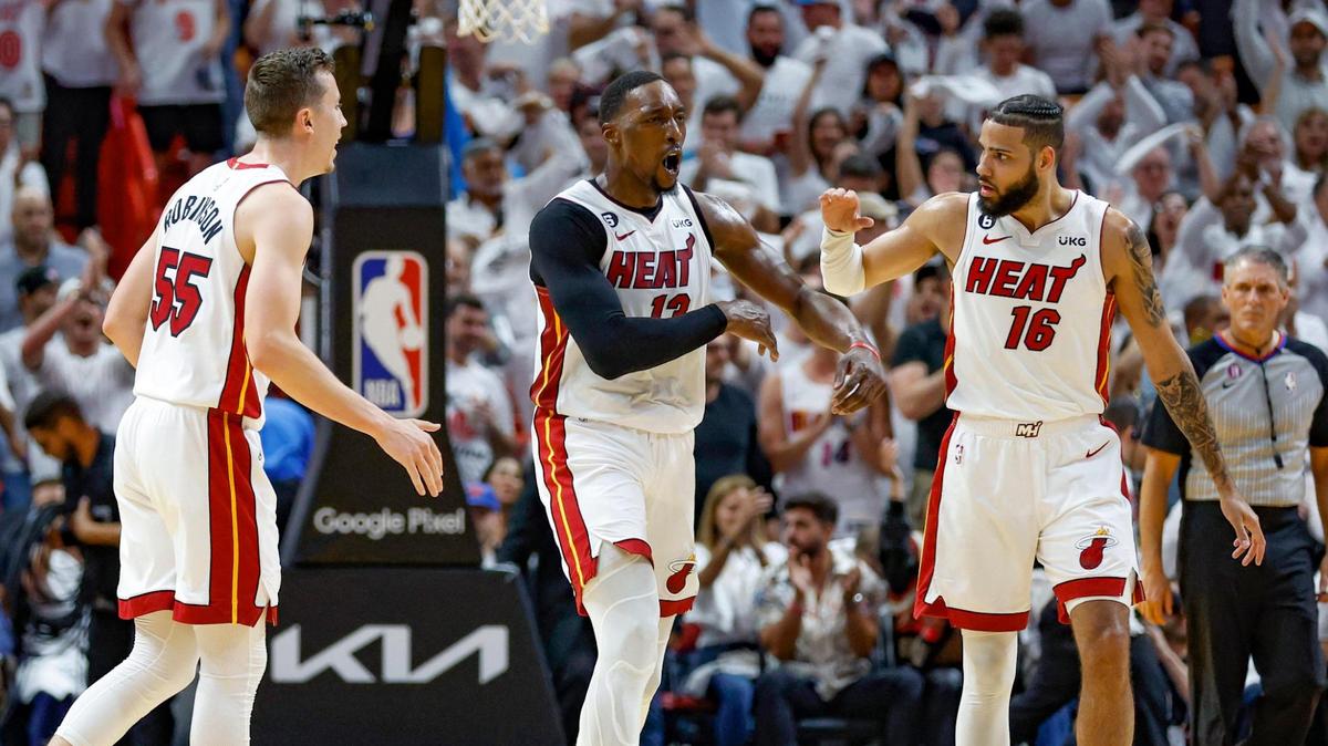 Miami Heat forward Duncan Robinson (55), Miami Heat center Bam Adebayo (13) and Miami Heat forward Caleb Martin (16) celebrate as they take the lead in the second quarter during the game against the New York Knicks in Game 6 of the NBA Eastern Conference Semifinals at the Kaseya Center in Miami on Friday, May 12, 2023.