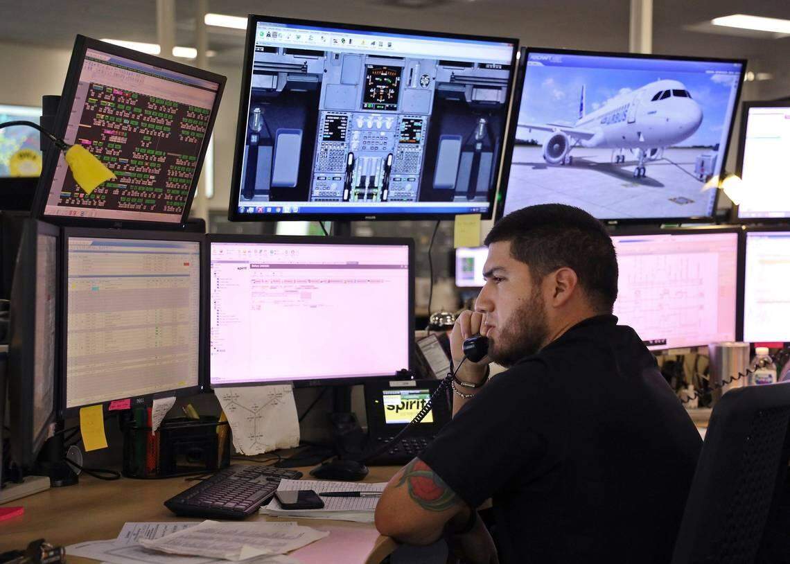 Maintenance controller John Hernandez handles calls inside Spirit Airlines’ Operation Control Center in Miramar in February 2019.
