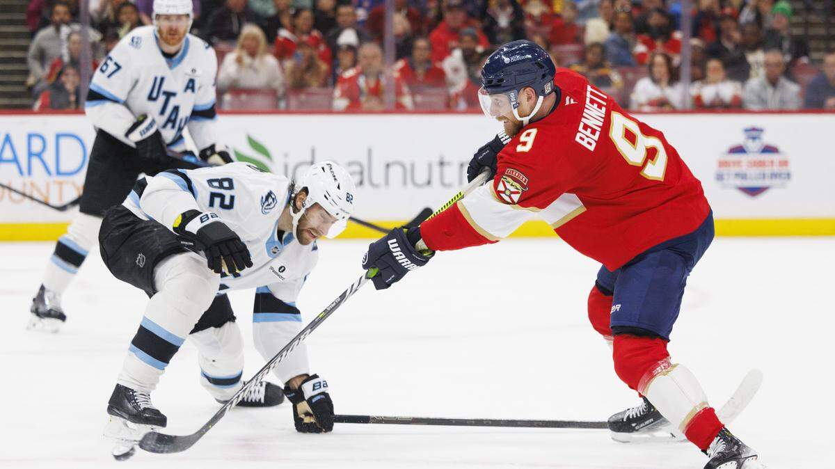 Florida Panthers center Sam Bennett (9) takes a shot on goal around Utah Mammoth center Kevin Stenlund (82) during the second period of a game on Tuesday, Jan. 27, 2026, at Amerant Bank Arena in Sunrise, Fla.