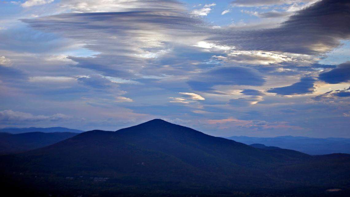 In this photo, clouds over Mt. Kearsarge North are seen on Thursday, Sept. 28, 2017. A hiker fell off a fire tower atop of the mountain’s peak before planning to take photos in New Hampshire, officials said.