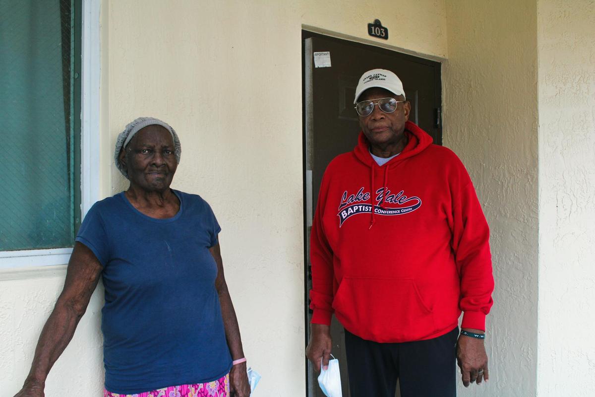 Juanita Williams, shown here with her cousin, Ulysses Harris, hasn’t been able to move back into the family home that burned almost five years ago.
