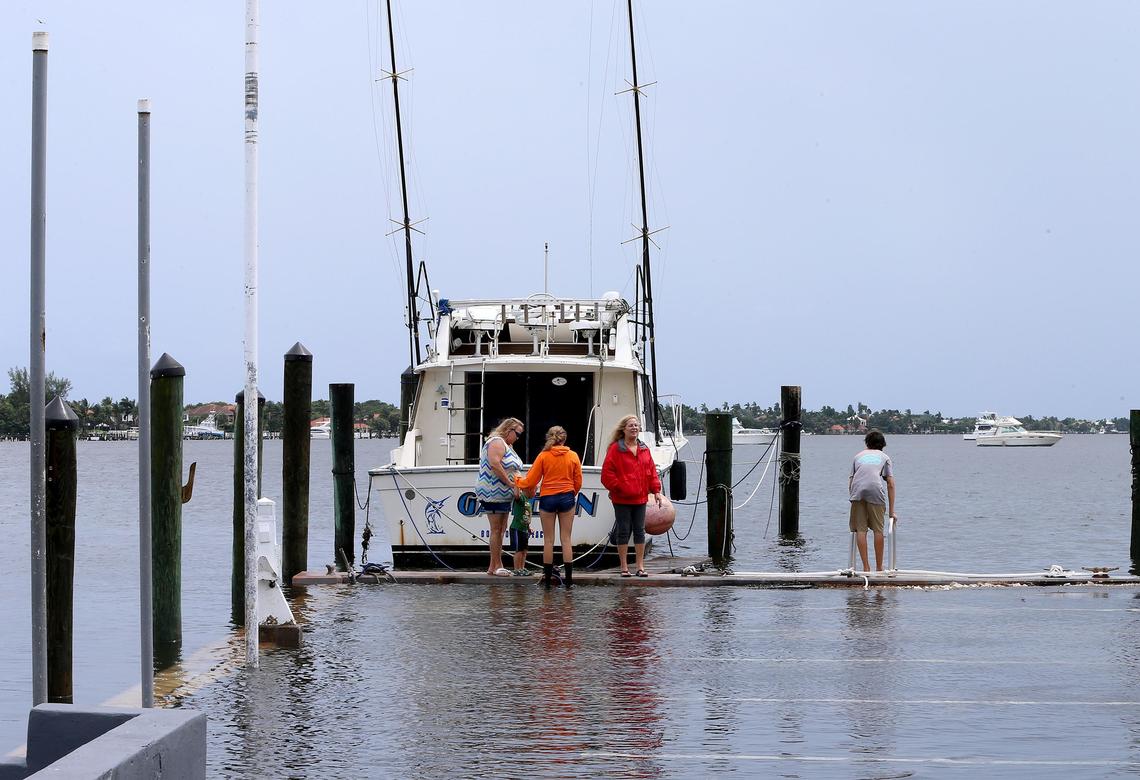 The “Game On,” a fishing vessel docked at Sportsman’s Park in Lantana, rose to parking lot level as the King Tide and swells from the hurricane caused the water to swell over the seawall on Tuesday, Sept. 3, 2019.