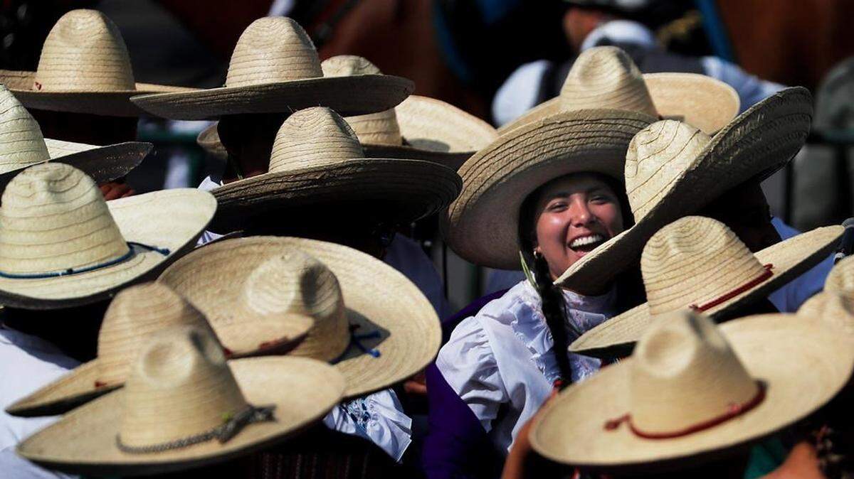 Mexicans dressed as “Adelitas,” or women soldiers, in a parade marking the 109th anniversary of the Mexican Revolution in Mexico City. More than a 1,000 participants dressed in time-period clothing and acted out historical scenes. (AP Photo/)