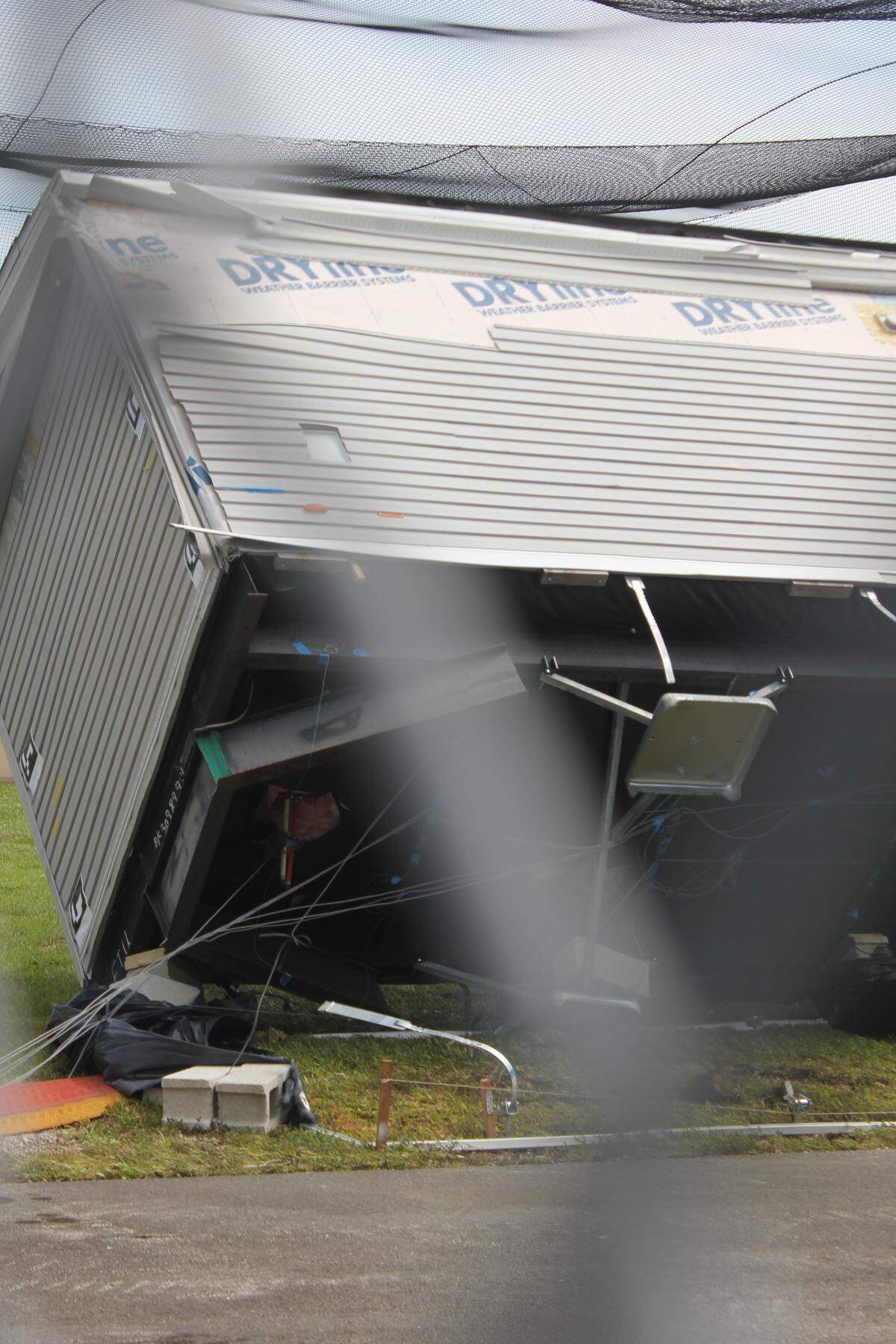 Manufactured home falls to the ground after strong winds detach the structure from its anchors to the ground at Florida International University’s School of Engineering on May 13, 2026.
