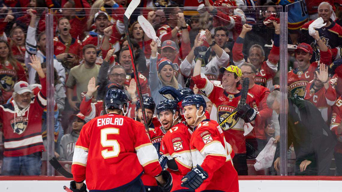 Florida Panthers center Evan Rodrigues (17) celebrates with his teammates after scoring a goal against Edmonton Oilers goaltender Stuart Skinner (74) in the third period of Game 2 of the NHL Stanley Cup Finals at the Amerant Bank Arena on Monday, June 10, 2024, in Sunrise, Fla.