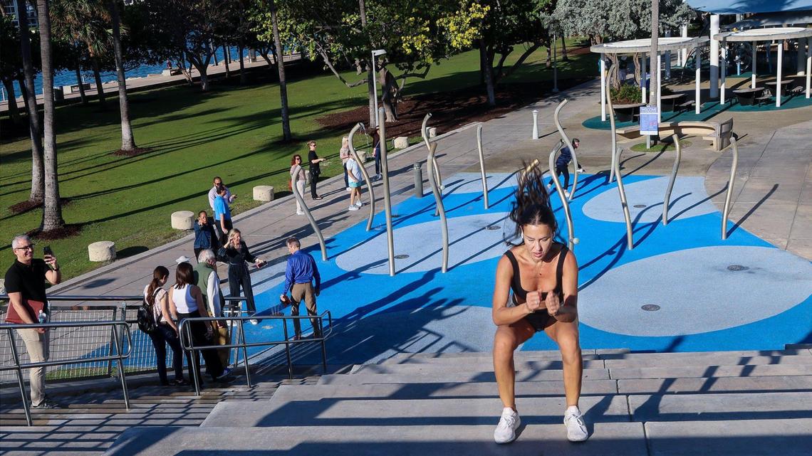 Eliana Lancellotti, 37, right, performs lunges while exercising as Miami Beach Vice Mayor Tanya Bhatt and city officials hosted a tour for Blue Zones experts at South Pointe Park to assess the city’s strengths, weaknesses, opportunities, and challenges on Wednesday, February 5, 2025 in Miami Beach, Florida.