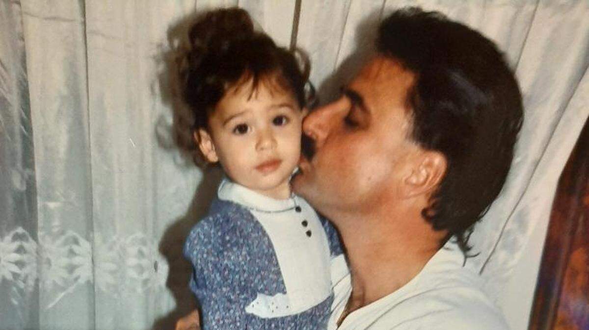 Heriberto Delvalle poses with his daughter in the early ’90s.