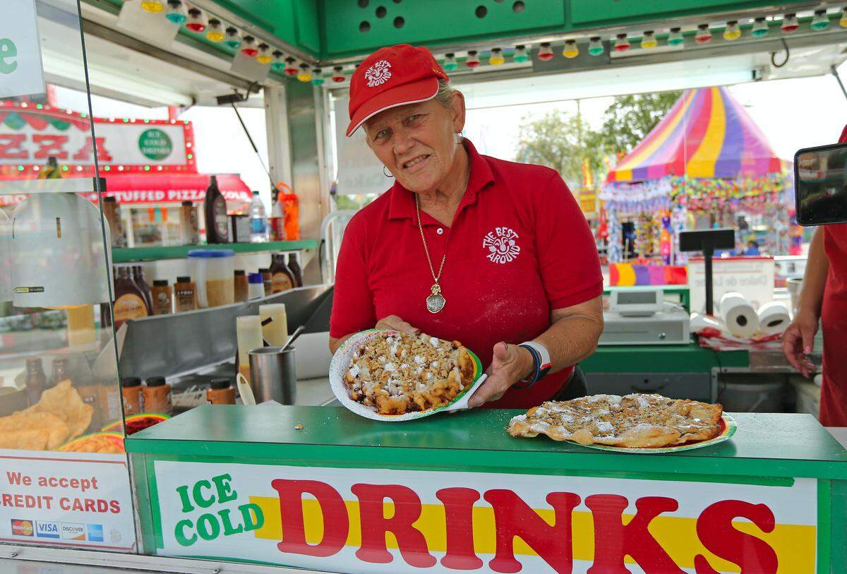 Jane Harris, aka Mama Jane, shows off her famous funnel cake at the fair in 2019. Get your fix after the scary rides for maximum enjoyment.