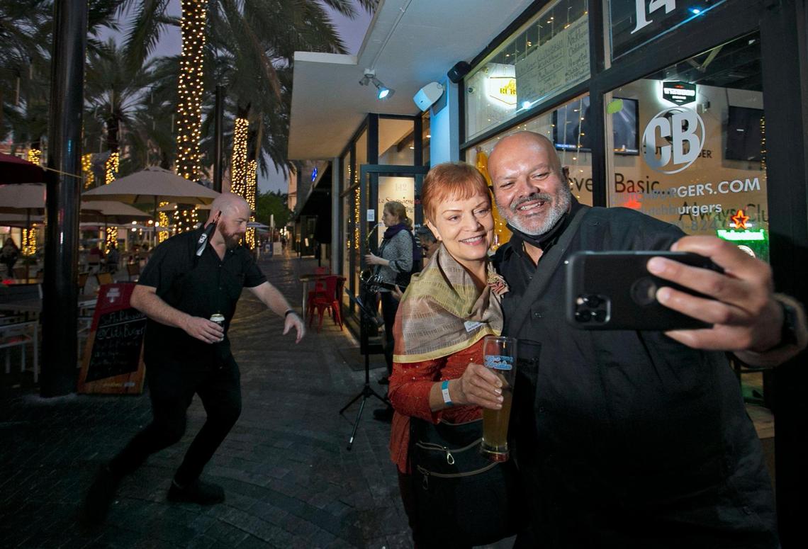 South Florida Professionals members Jan Hurley and Andy Rodriguez take a selfie at Clutch Burger on Giralda Plaza during the group’s first networking event since the outbreak of COVID-19.