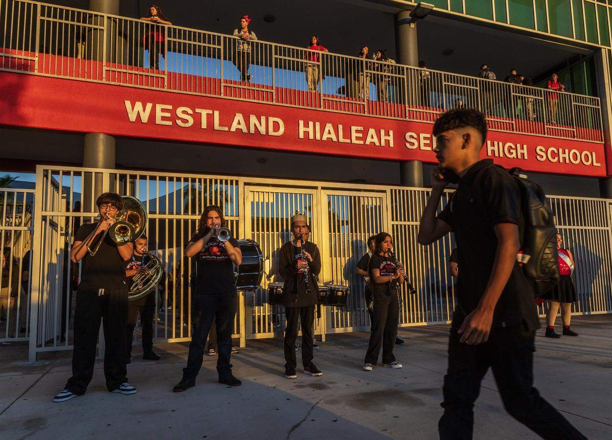 School band members from the Westland Hialeah Senior High School performs to welcome students during, the first day of school for Miami-Dade County Public Schools (M-DCPS) in the 2025-2026 school year, on Thursday, August 14, 2025.