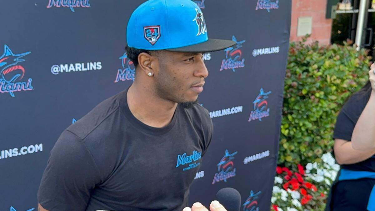 Shortstop Tim Anderson speaks to reporters on his first official day taking part in spring training with the Miami Marlins at Roger Dean Chevrolet Stadium in Jupiter, Fla.