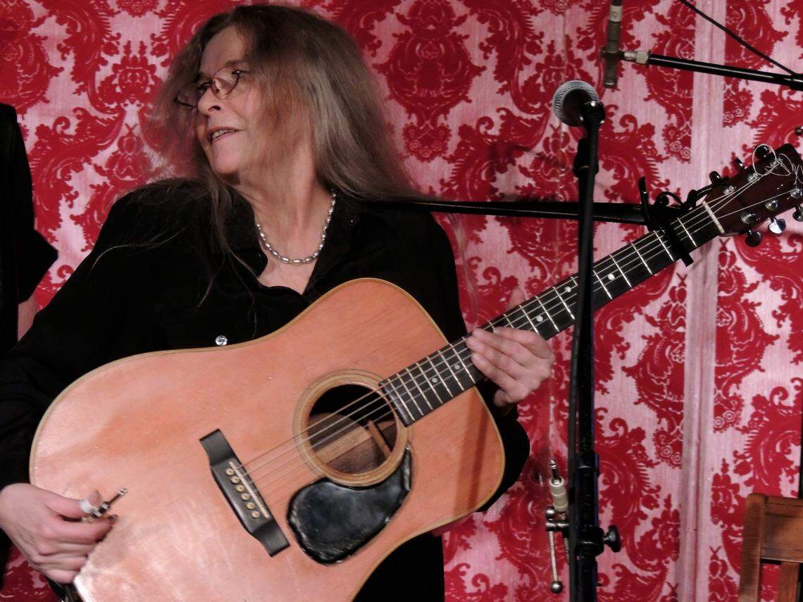 Folk singer Estrella Berosini performs at a 50th anniversary reunion concert for The Flick Coffeehouse on a stage in what is now Titanic Restaurant & Brewery on Ponce de Leon in Coral Gables in this file photo from March 28, 2014. Berosini, and brother Bill, children of a high wire circus performer, played The Flick in the 1960s and early 1970s, for a while when she was just 15. ‘They gave me age-inappropriate songs to sing,’ she joked onstage, as she sang one of those songs, ‘Crackers in Bed.’ Berosini, who would talk music with another Flick performer, Joni Mitchell, backstage at the venue, was immortalized in the lyrics of Mitchell’s 1970 song, ‘Ladies of the Canyon.’