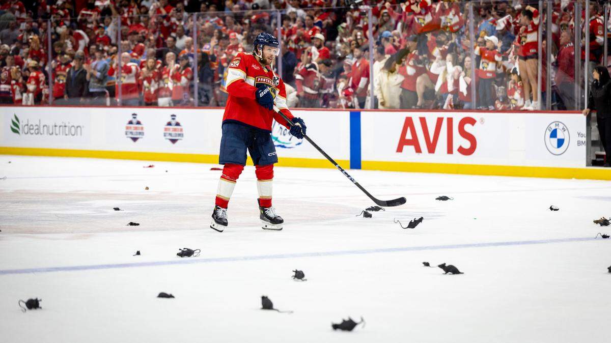 Florida Panthers center Carter Verhaeghe (23) slaps rubber rats into the goal after the Panthers defeated the Oilers in Game 3 of the Stanley Cup Finals at Amerant Bank Arena on Monday, June 9, 2025, in Sunrise, Fla.