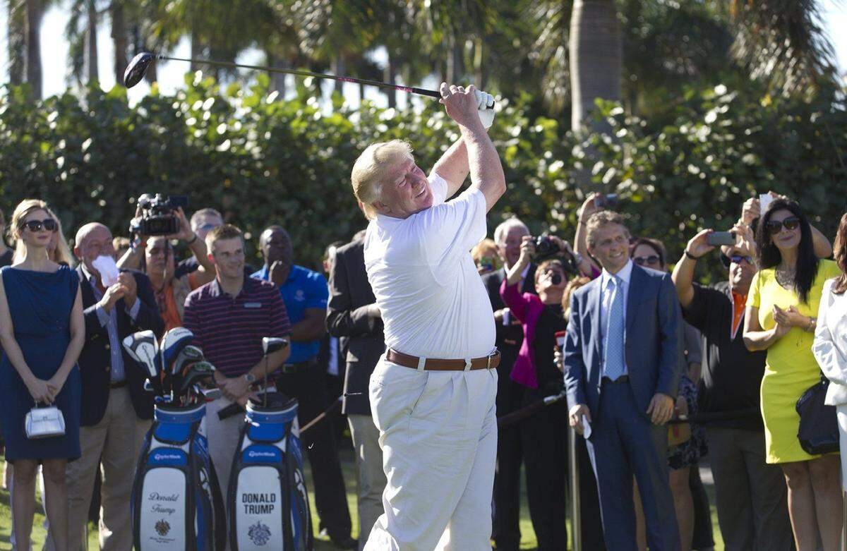 Donald Trump shows off his updated course by the hitting a ceremonial tee shot off the first tee at Trump Doral on Feb. 6, 2014.