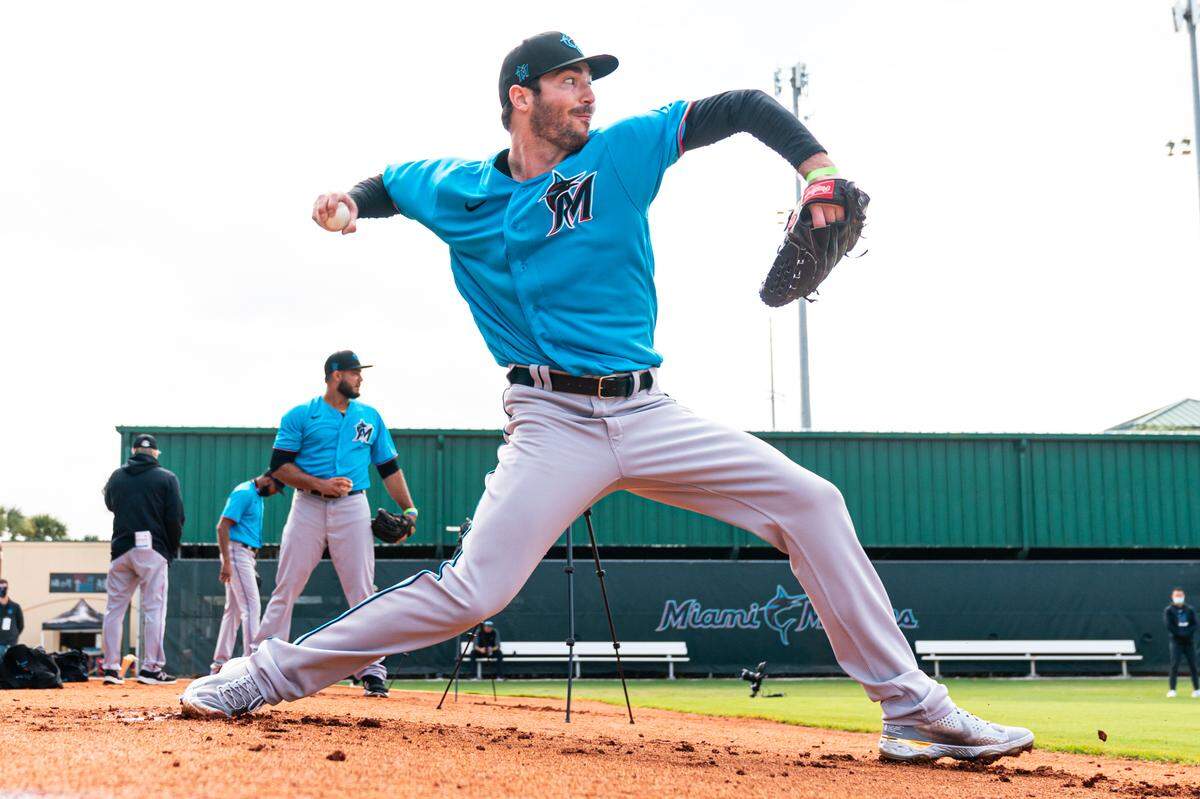 Miami Marlins relief pitcher John Curtiss throws a bullpen session on Sunday, Feb. 21, 2021, at the Roger Dean Chevrolet Stadium complex in Jupiter, Florida.