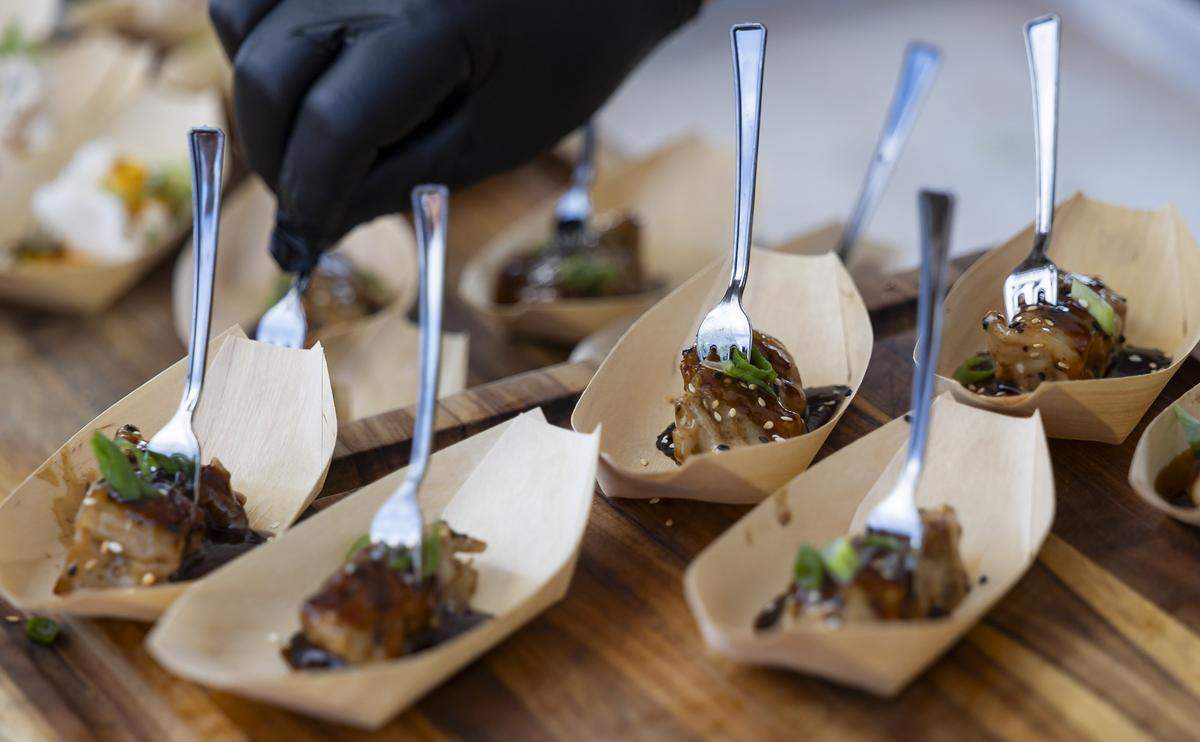 An A5 Japanese Wagyu Potsticker is prepared for guests inside the Goya Foods' Grand Tasting Village during the Food Network South Beach Wine & Food Festival on Saturday, Feb. 21, 2026, in Miami Beach, Fla.