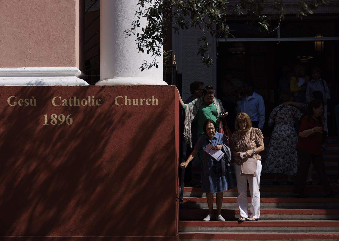 People walk of the church after Ash Wednesday mass on Wednesday, Feb. 18, 2026, at Gesu Catholic Church in downtown Miami.  The mass was fully packed with standing room only at the back of the church. 