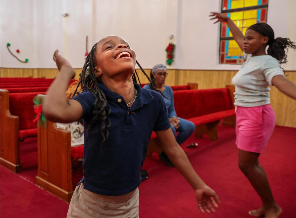 Raniya Benjamin, 8, left, and Jayilah Lambright, 12, right, are Macedonia Missionary Baptist Church congregants. The church is building an addition to its facility to accommodate more children for its afterschool and summer programs.