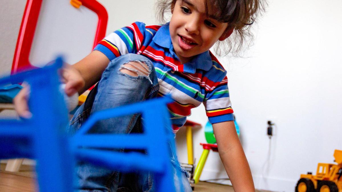 David Silva Jr., 4, a special needs child, plays in his room with some toys at his parent’s apartment in Miami, Florida on Sunday, May 3, 2020. After his care facility closed due to the coronavirus pandemic hihs mother quit her job to care for him daily.