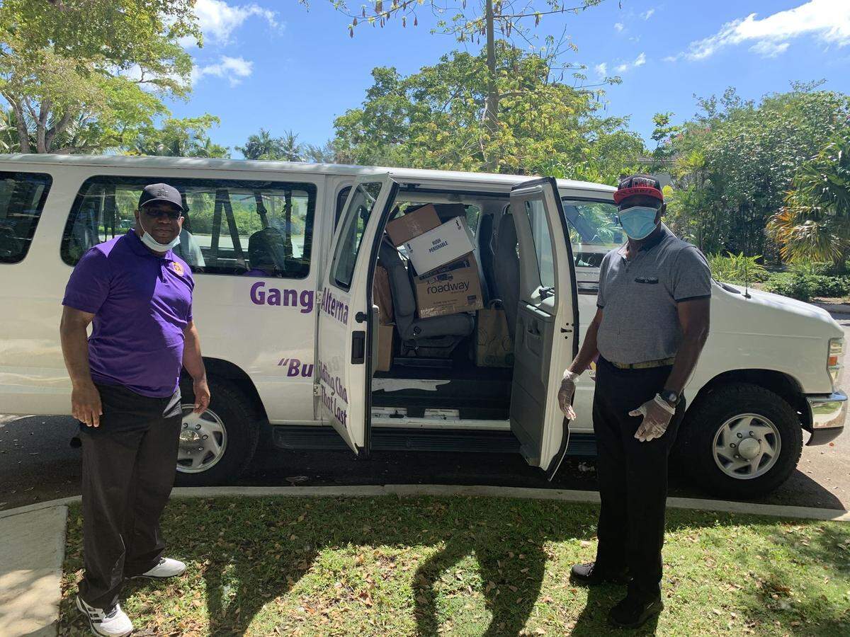 Jose A. Gonzalez and&nbsp;Willy Saint-Hilaire&nbsp;with Gang Alternative, Inc. help deliver food donated by residents of Morningside to help families in Little Haiti.