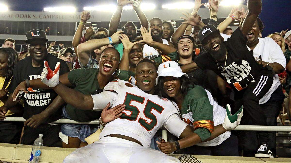 Miami linebacker Shaquille Quarterman (55) celebrates with fans after a 24-20 win against Florida State at Doak Campbell Stadium in Tallahassee, Fla., on Saturday, Oct. 7, 2017. On Monday, July 23, 2018, Quarterman was nominated for the Butkus Award.
