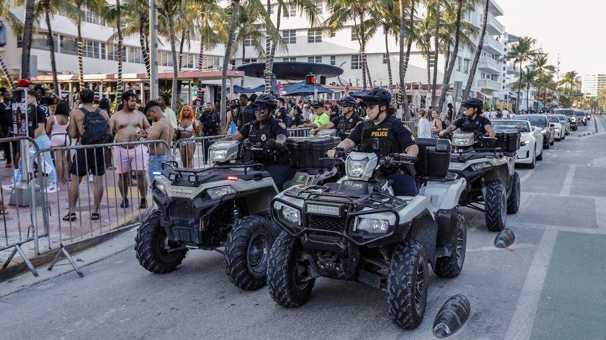 Miami Beach police officers patrol Ocean Drive on ATVs during spring break on Sunday, March 17, 2024.