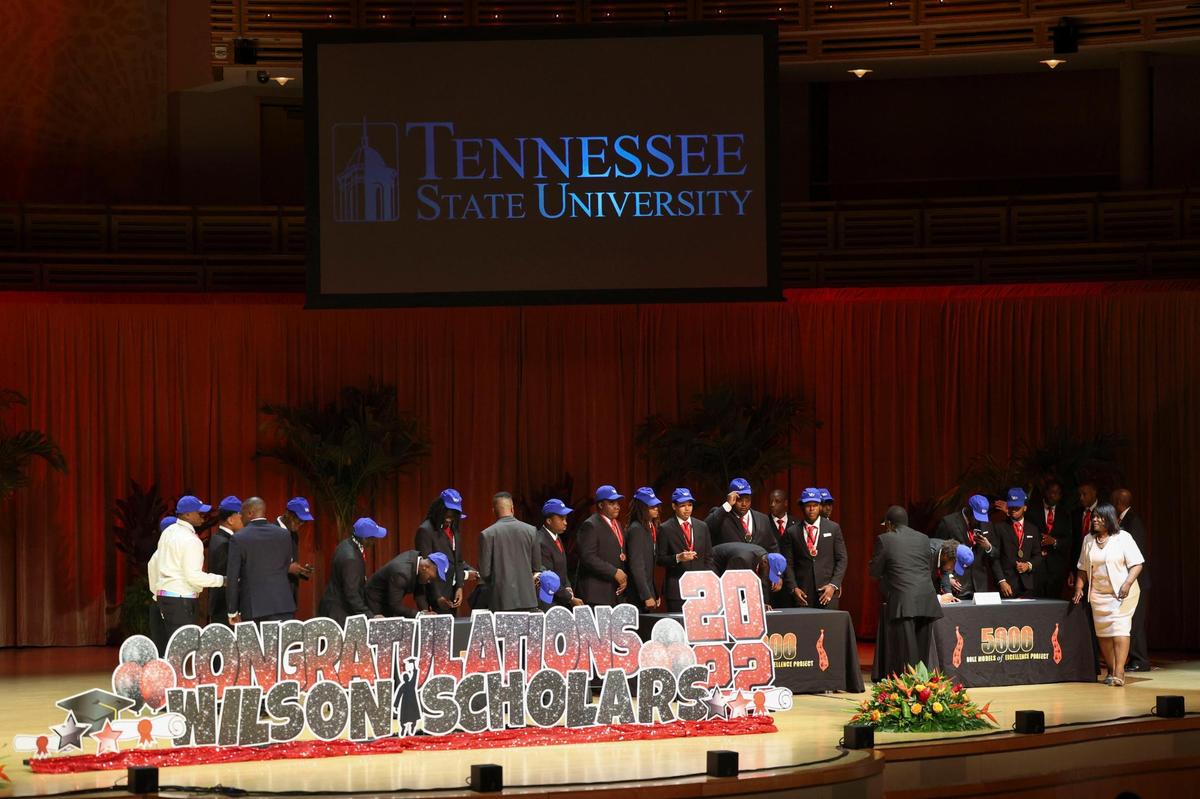 Some of the 42 young men receiving full rides to Tennessee State University stand during the scholarship ceremony for the Wilson Scholars of the 5000 Role Models of Excellence Program on Sunday, June 5, 2022, at the Adrienne Arsht Center.