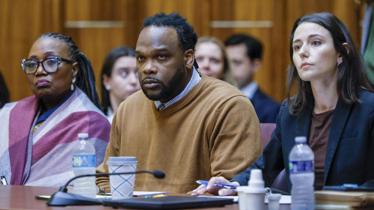 Rashaun Jones, who is accused of killing his University of Miami football teammate Bryan Pata in 2006, sits with defense attorneys Bonita E Jones Peabody, at left and Sara Alvarez, at right, during opening statements in Judge Cristina Miranda Courtroom 4-1 at the Richard E. Gerstein Justice Building on Wednesday, February 18, 2026.