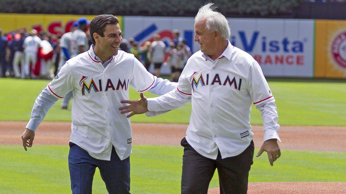 Happier times: City of Miami Mayor Francis X. Suarez and Carlos A. Gimenez, then Miami-Dade County’s mayor, after throwing out an opening pitch at Marlins Park in Little Havana on Thursday, March 29, 2018. Now they’re foes, and it’s going national.