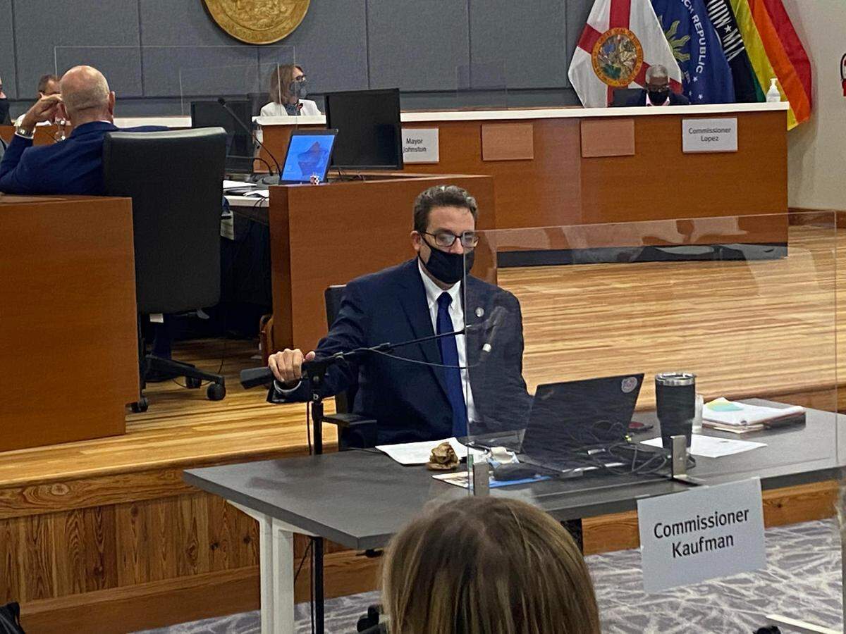 Key West City Commissioner Sam Kaufman sat apart from the other commissioners behind a piece of plexiglass at the commission’s Oct. 6, 2020, meeting.