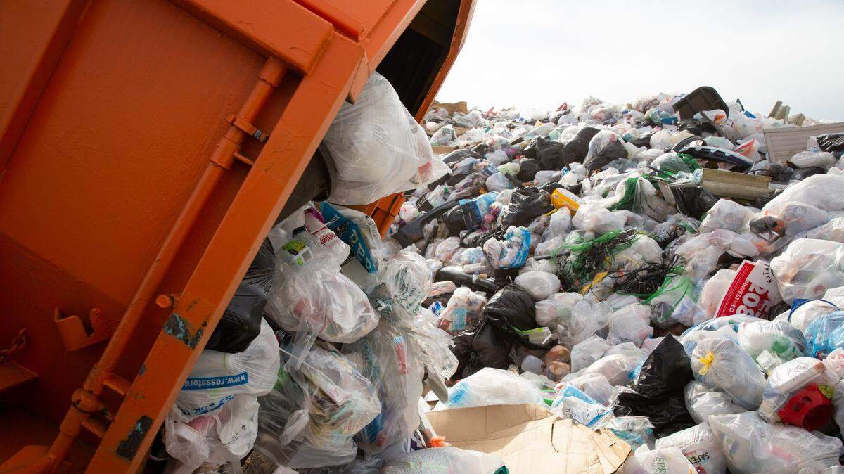 A dumpster full of recycled plastic is emptied at Tank’s Speedway Recycling and Landfill in Tucson, Arizona, in March.  