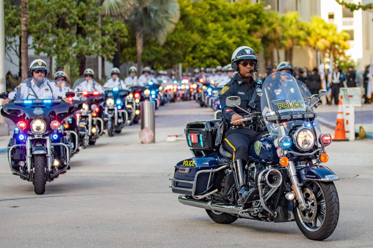 Police officers and other law enforcement members line up in a procession before fallen Officer Cesar “Echy” Echaverry’s memorial service at loanDepot park in Miami, Florida, on Wednesday, Aug. 24, 2022.