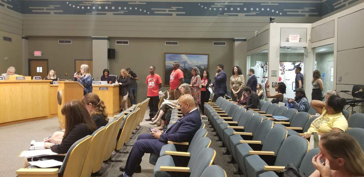 Residents and neighbors of Little Haiti line up to speak at the Planning and Zoning Board hearing on Wednesday, Oct. 16, to protest the proposed Eastside Ridge real estate development.