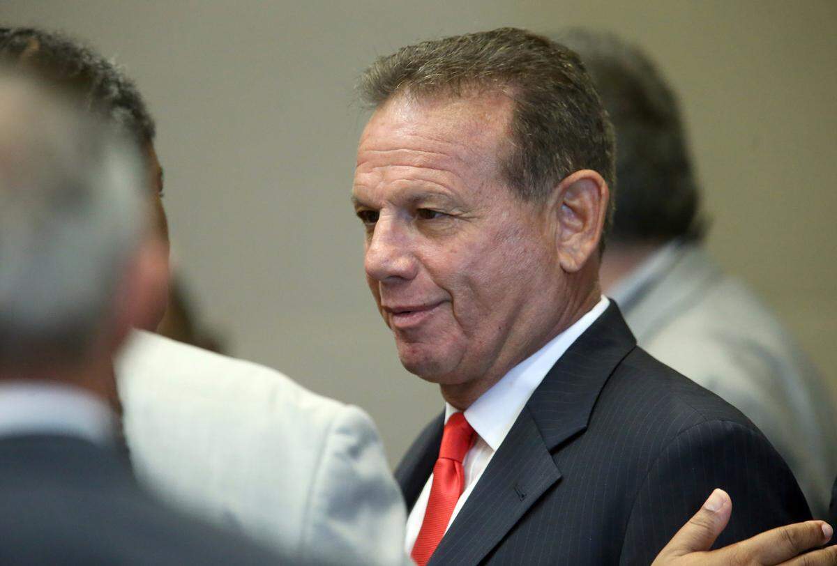 Former Broward County Sheriff Scott Israel, center, tested positive for COVID-19 and has been hospitalized, campaign staffers said Wednesday.