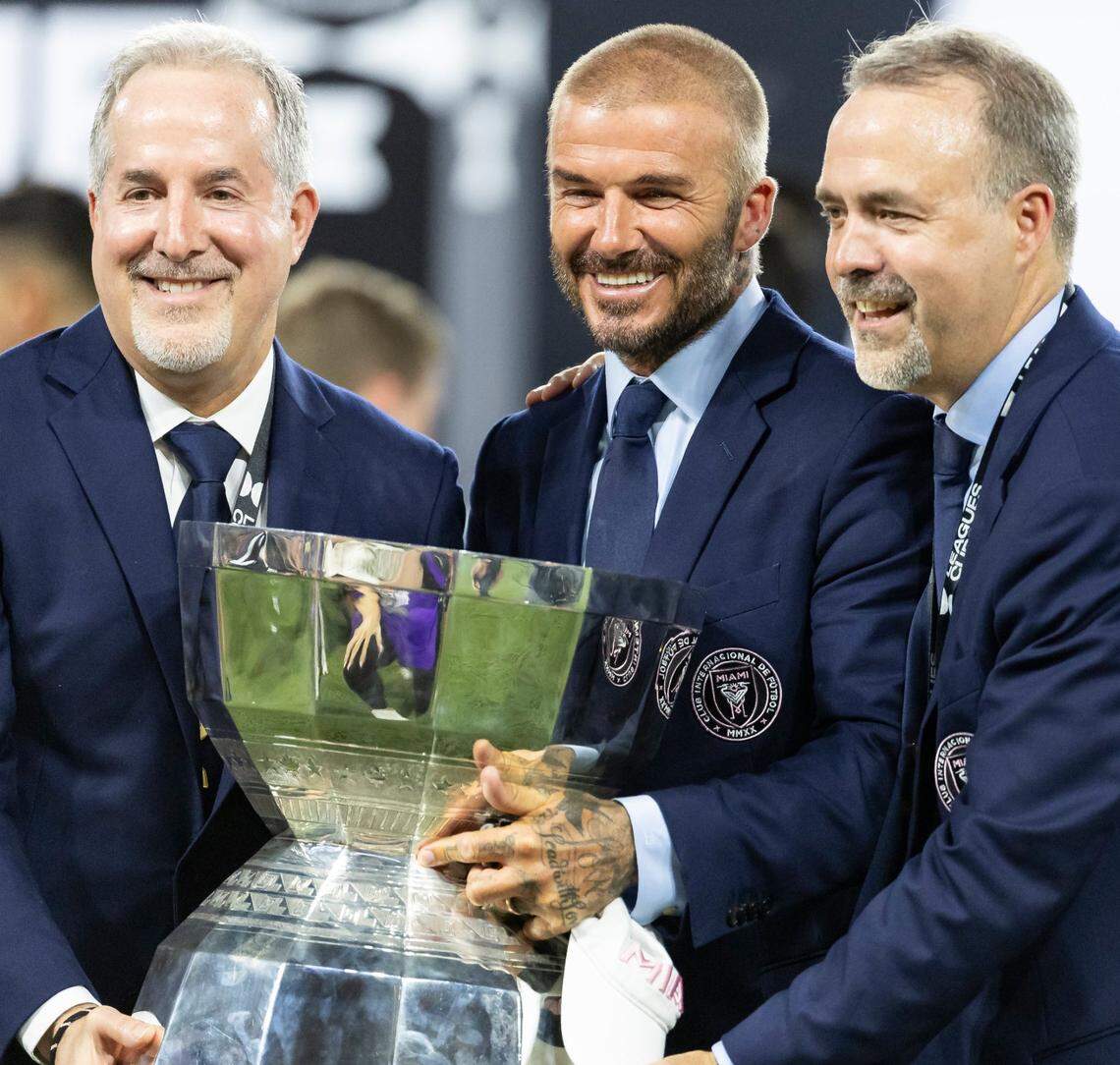 Inter Miami co-owners Jorge Mas, David Beckham and Jose Mas hold the Leagues Cup after their team defeated Nashville SC in the final match of the tournament. The Leagues Cup is Inter Miami’s first championship.