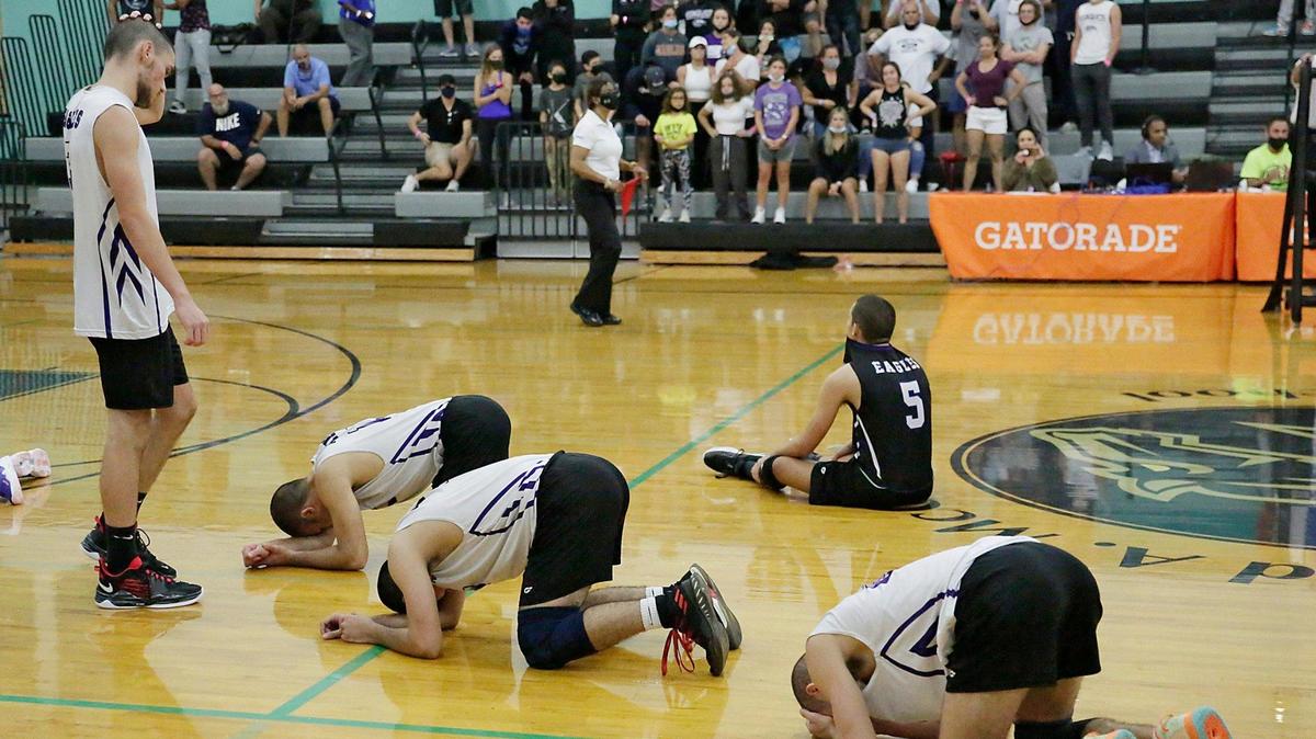 Southwest Eagles players cry after losing FHSAA Boys Volleyball State Championship game to Freedom Patriots (Orlando) on Saturday, May 15, 2001 at Archbishop McCarthy HS in Southwest Ranches