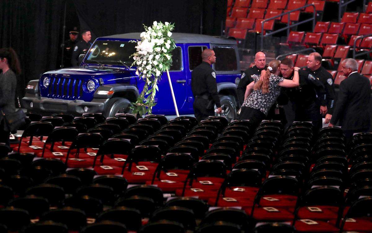 Mourners gather near the Jeep of slain Hollywood Police Officer Yandy Chirino at FLA Live Arena (formerly BB&T Center) before the 10 a.m. funeral services on Monday, Nov. 1, 2021. Chirino was killed during a late-night altercation on Sunday, Oct. 17, with a teenage suspect.
