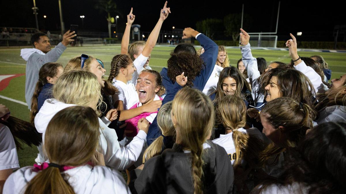 St. Thomas Aquinas cheers after winning the regional soccer final against Our Lady of Lourdes on Wednesday, Feb. 21, 2024, at Columbus High School in Miami. Aquinas won 3-1.
